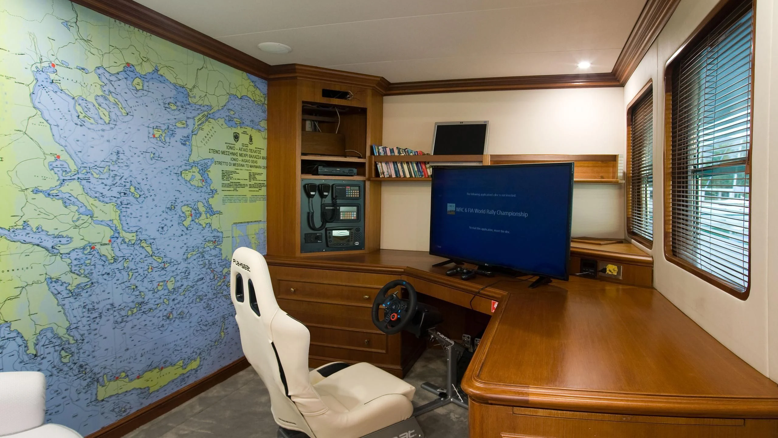 a room with a desk and a computer aboard WIND OF FORTUNE Yacht for Charter