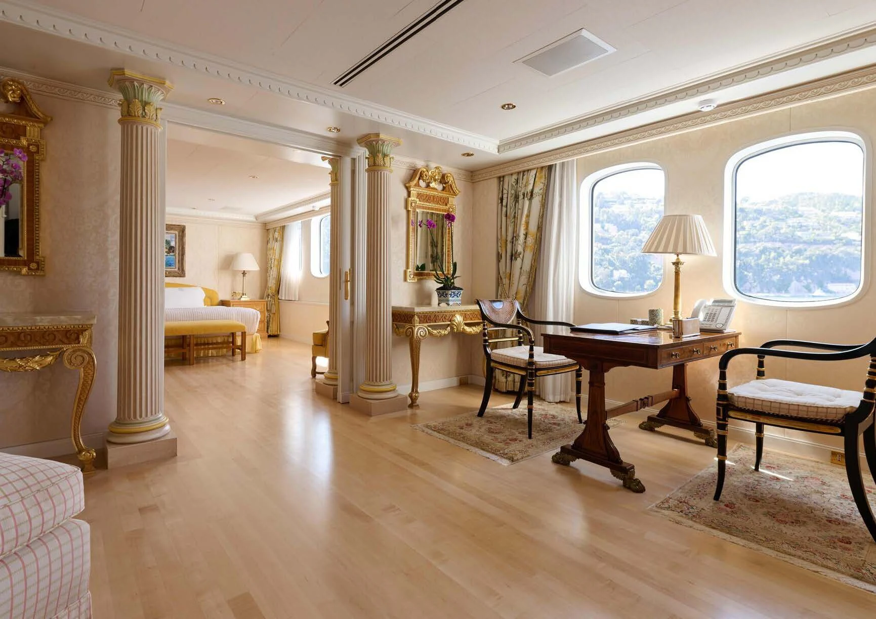 a large room with a table and chairs aboard LADY BEATRICE Yacht for Sale