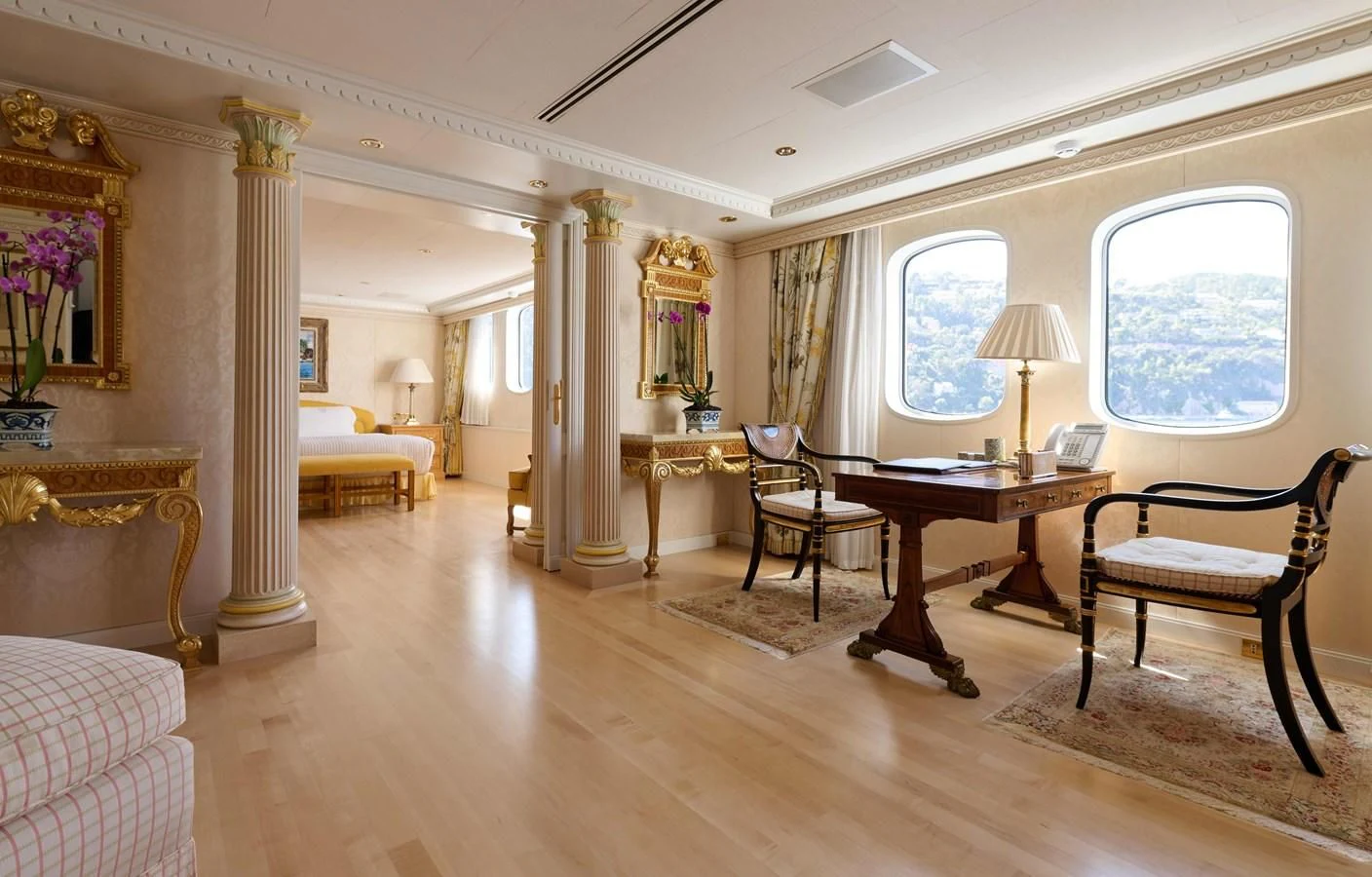 a large room with a table and chairs aboard LADY BEATRICE Yacht for Sale