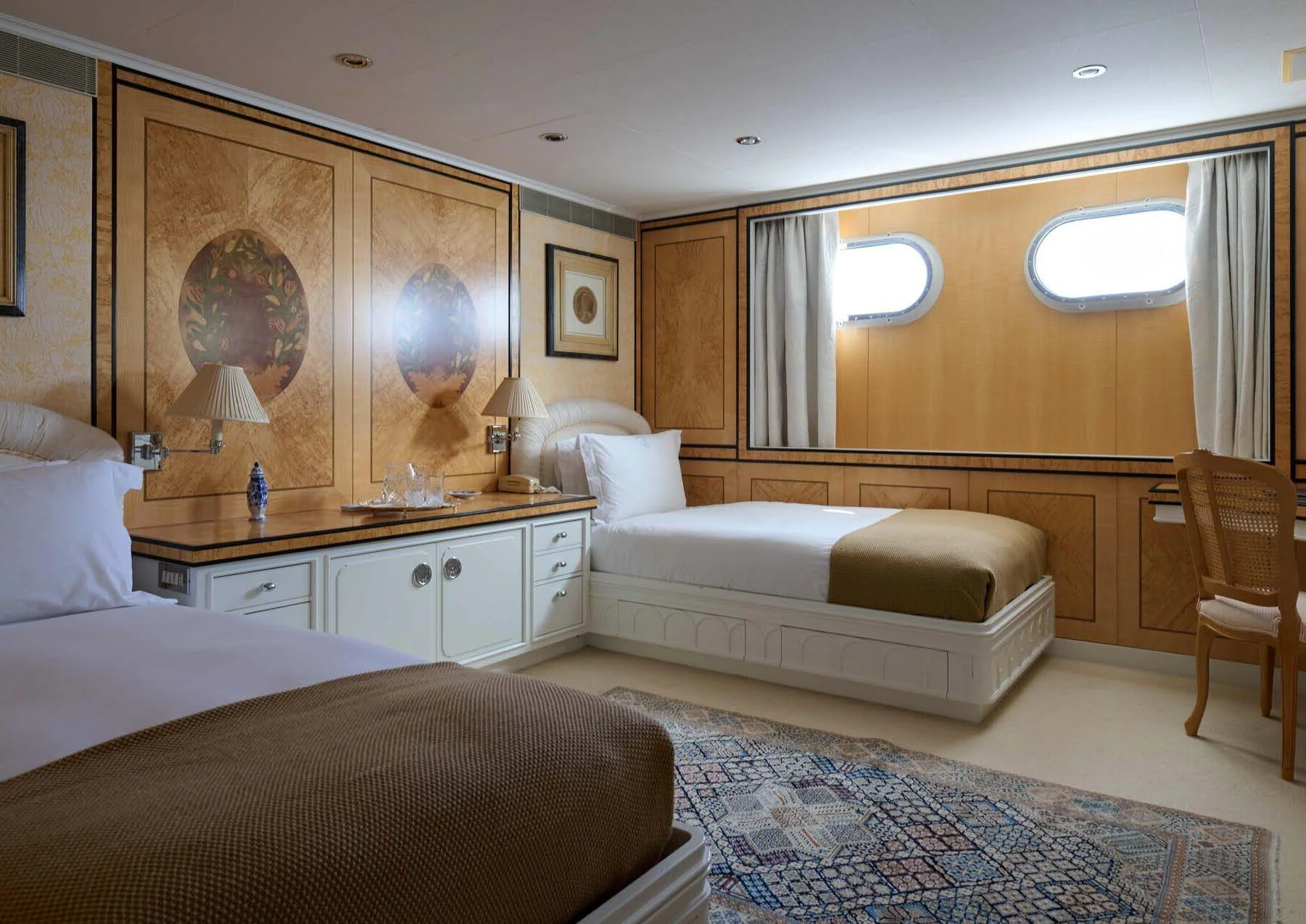 a room with a bed and a couch aboard LADY BEATRICE Yacht for Sale
