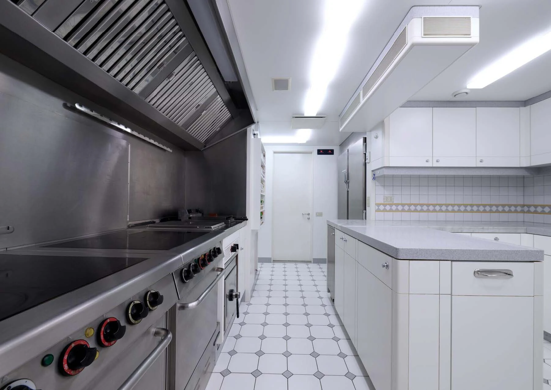 a kitchen with white cabinets aboard LADY BEATRICE Yacht for Sale