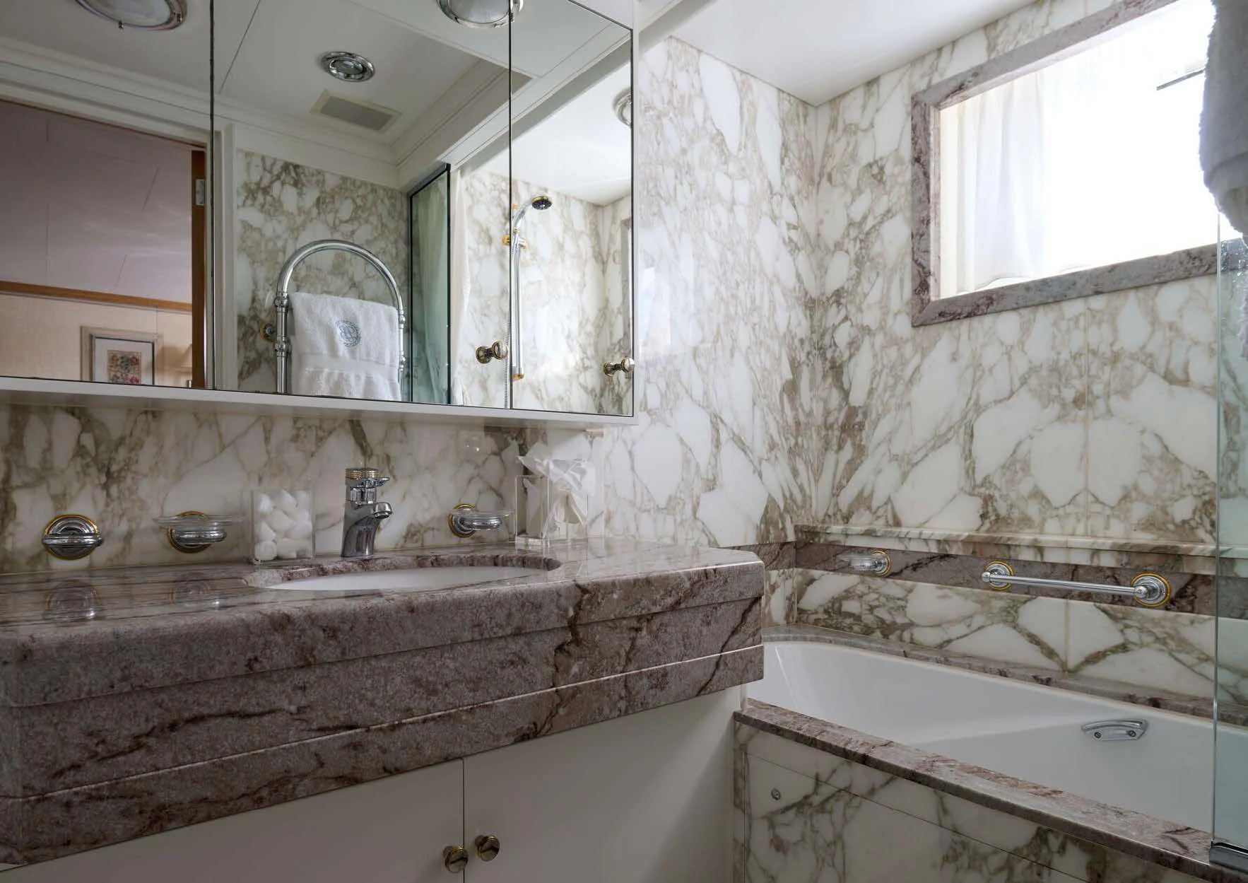 a bathroom with a bathtub and sink aboard LADY BEATRICE Yacht for Sale