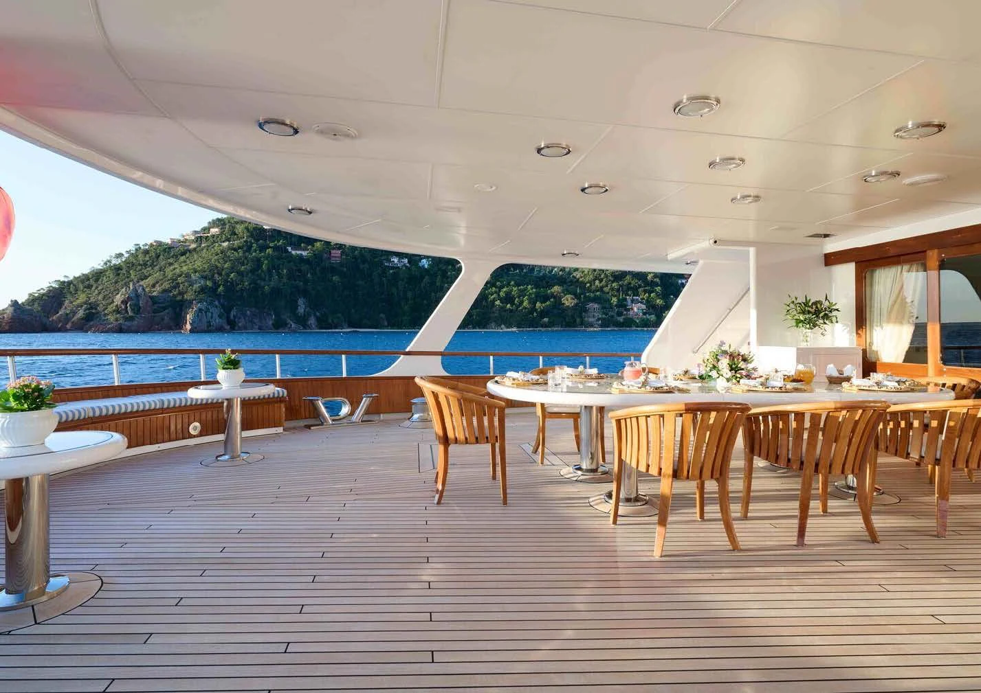 a room with tables and chairs aboard LADY BEATRICE Yacht for Sale