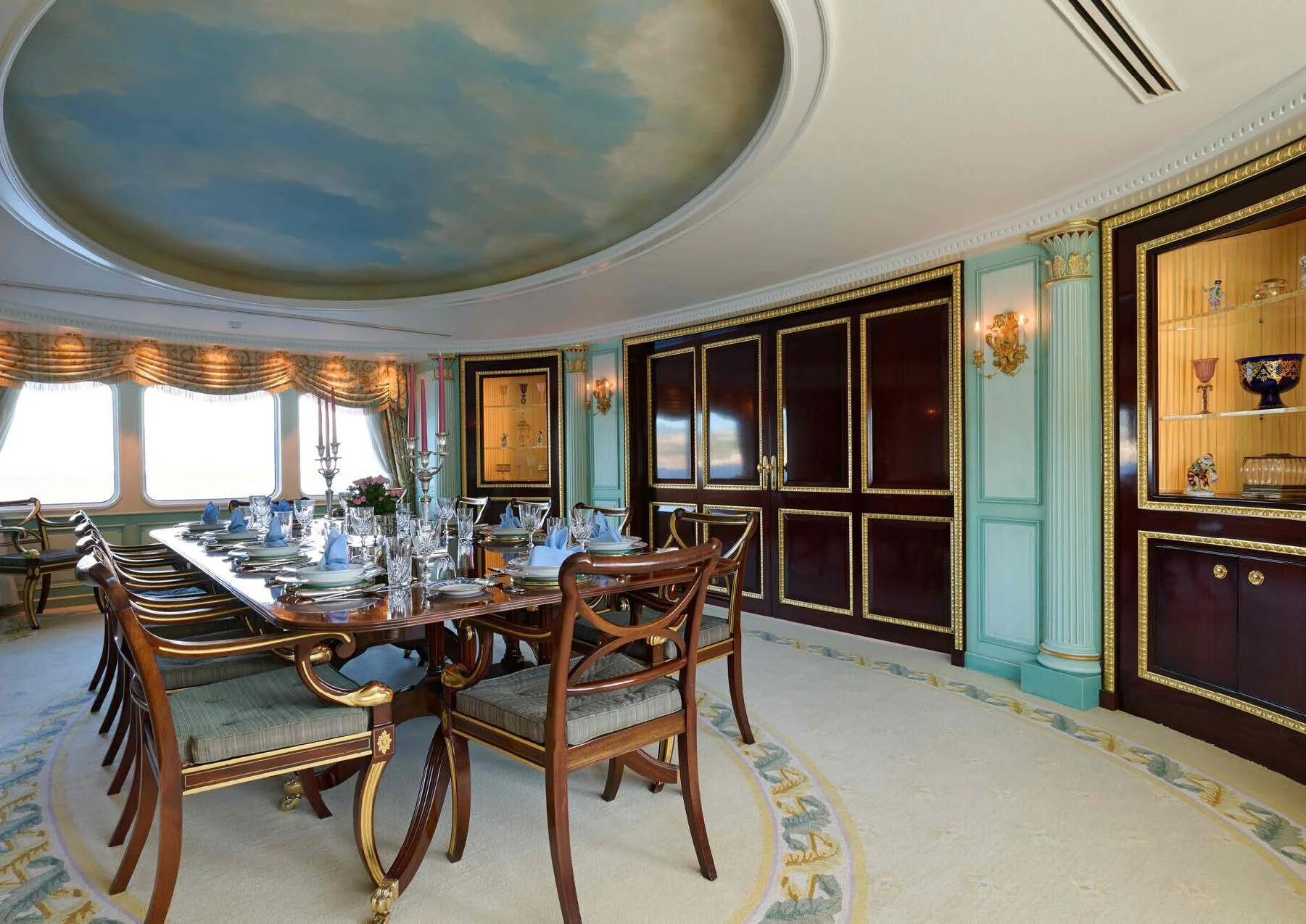 a dining room with a table and chairs aboard LADY BEATRICE Yacht for Sale