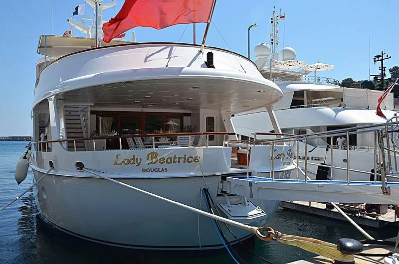 a boat docked at a pier aboard LADY BEATRICE Yacht for Sale