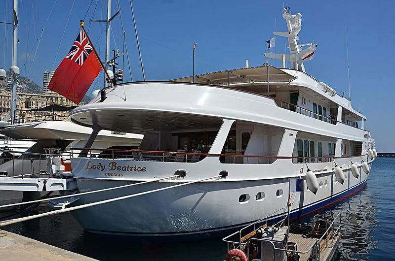 a boat docked at a pier aboard LADY BEATRICE Yacht for Sale