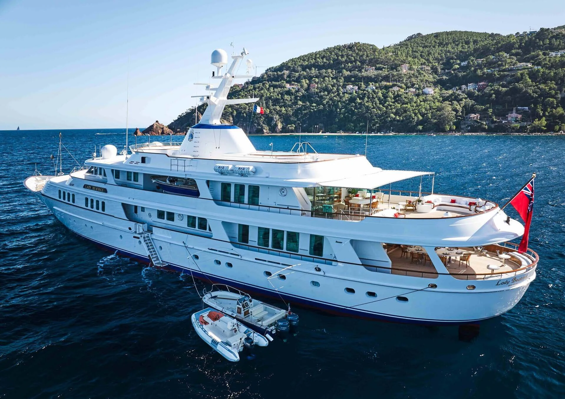 a large white boat in the water aboard LADY BEATRICE Yacht for Sale