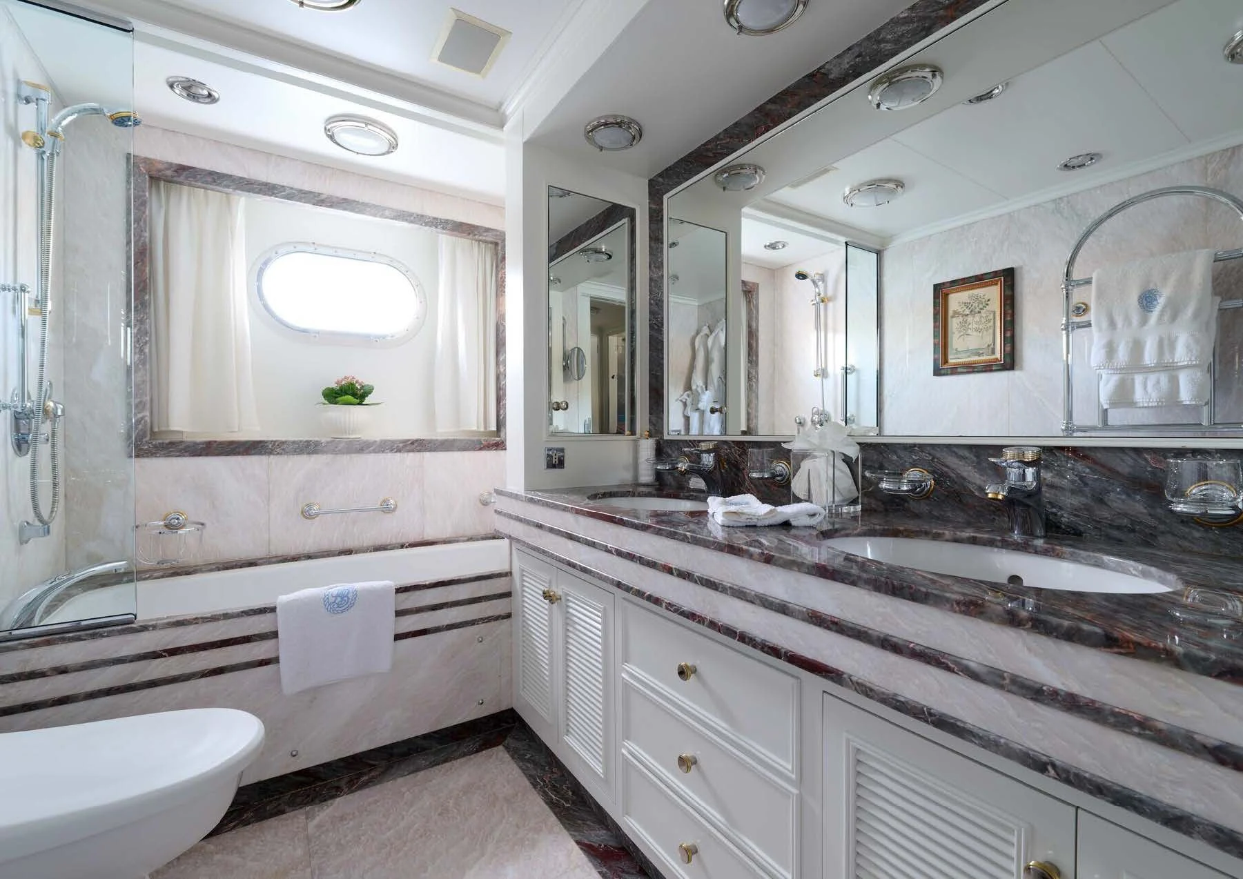 a bathroom with a large mirror aboard LADY BEATRICE Yacht for Sale