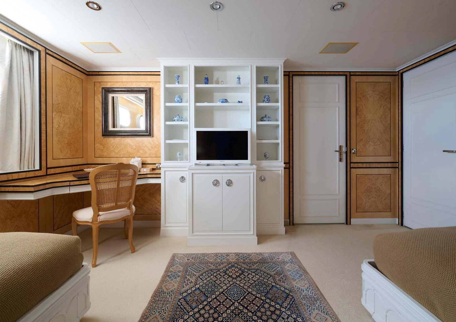 a room with a bed and a tv aboard LADY BEATRICE Yacht for Sale