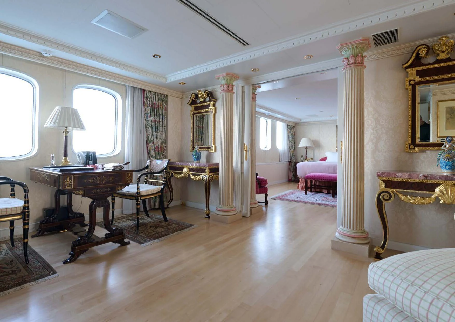 a large room with a table and chairs aboard LADY BEATRICE Yacht for Sale