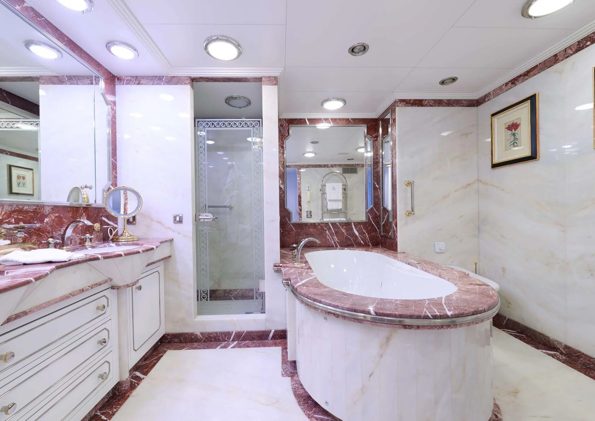 a bathroom with a large pink tub aboard LADY BEATRICE Yacht for Sale