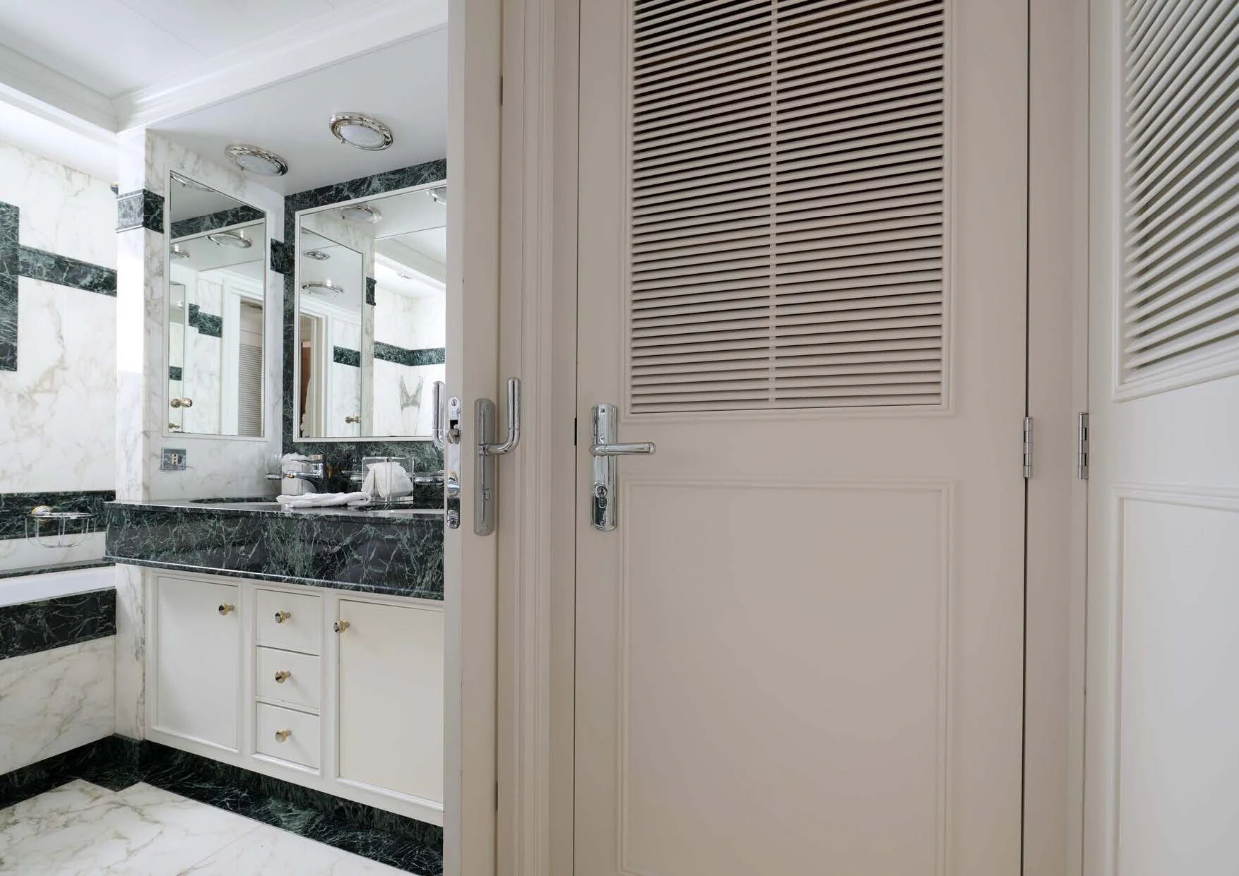 a bathroom with a sink and cabinets aboard LADY BEATRICE Yacht for Sale