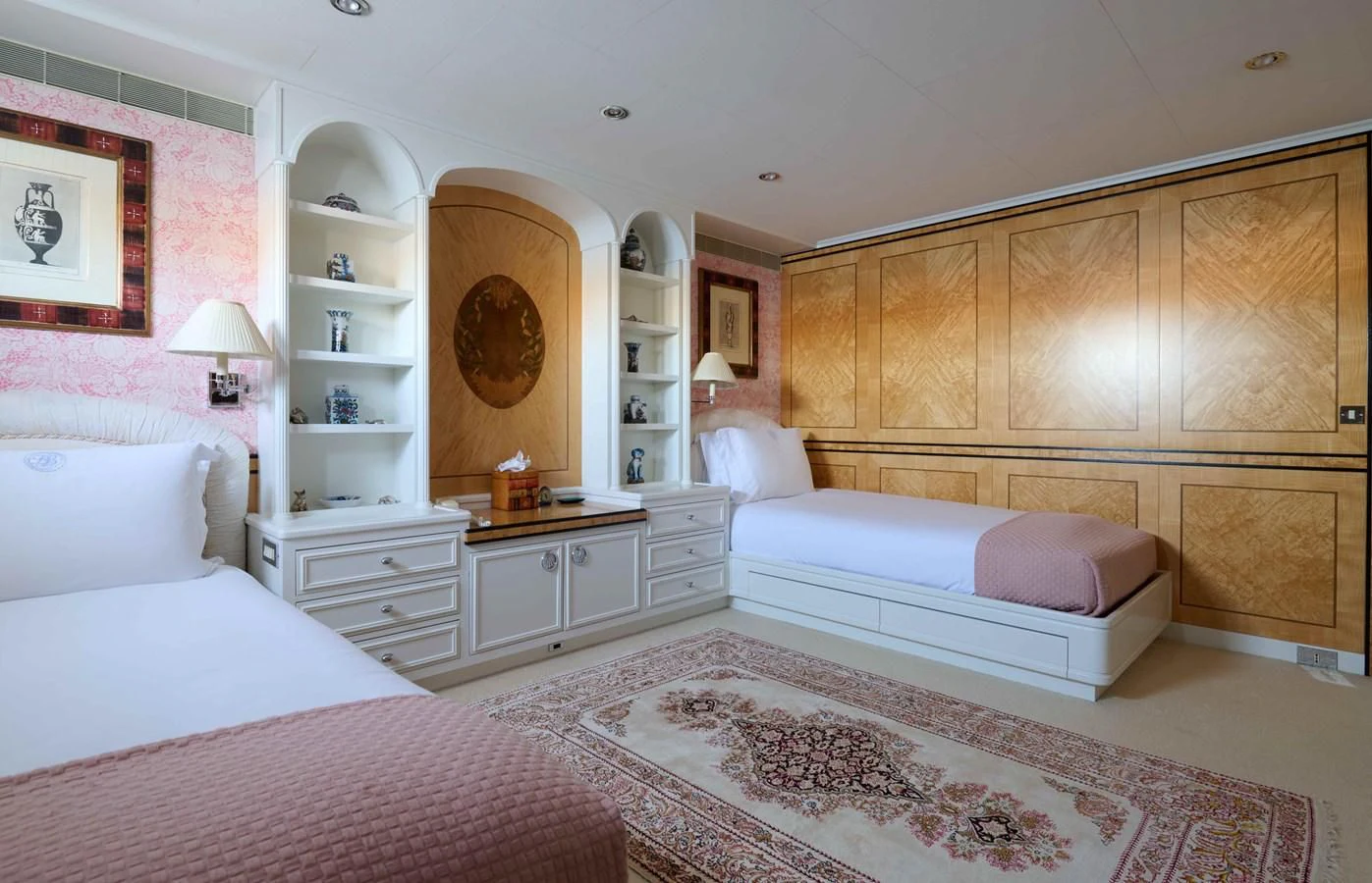a room with a bed and a mirror aboard LADY BEATRICE Yacht for Sale