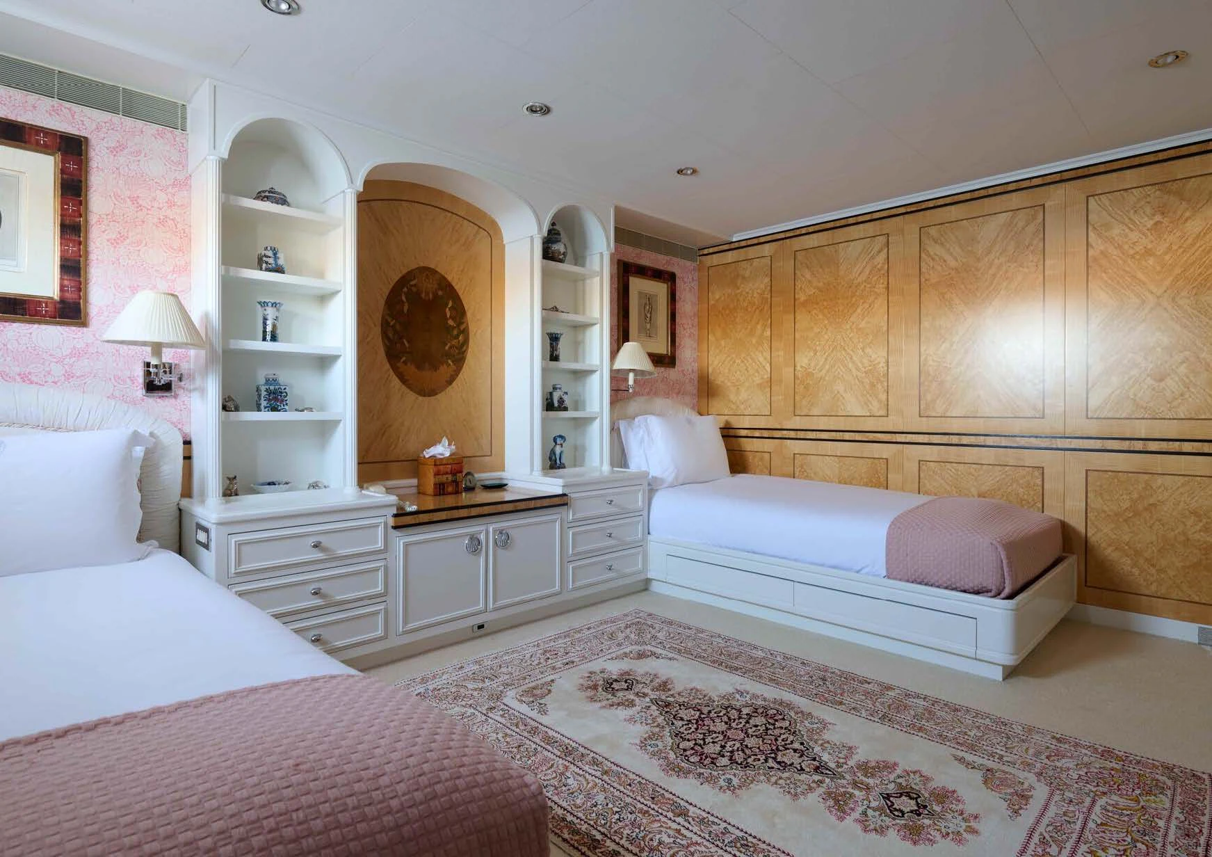a bedroom with a couple of beds aboard LADY BEATRICE Yacht for Sale