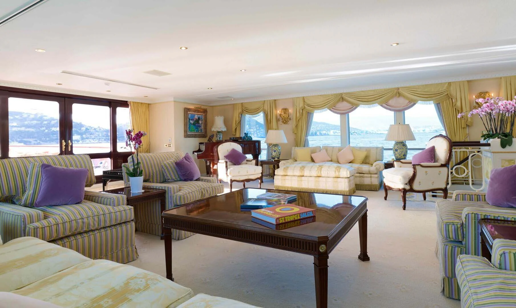 a living room with a large window aboard LADY BEATRICE Yacht for Sale