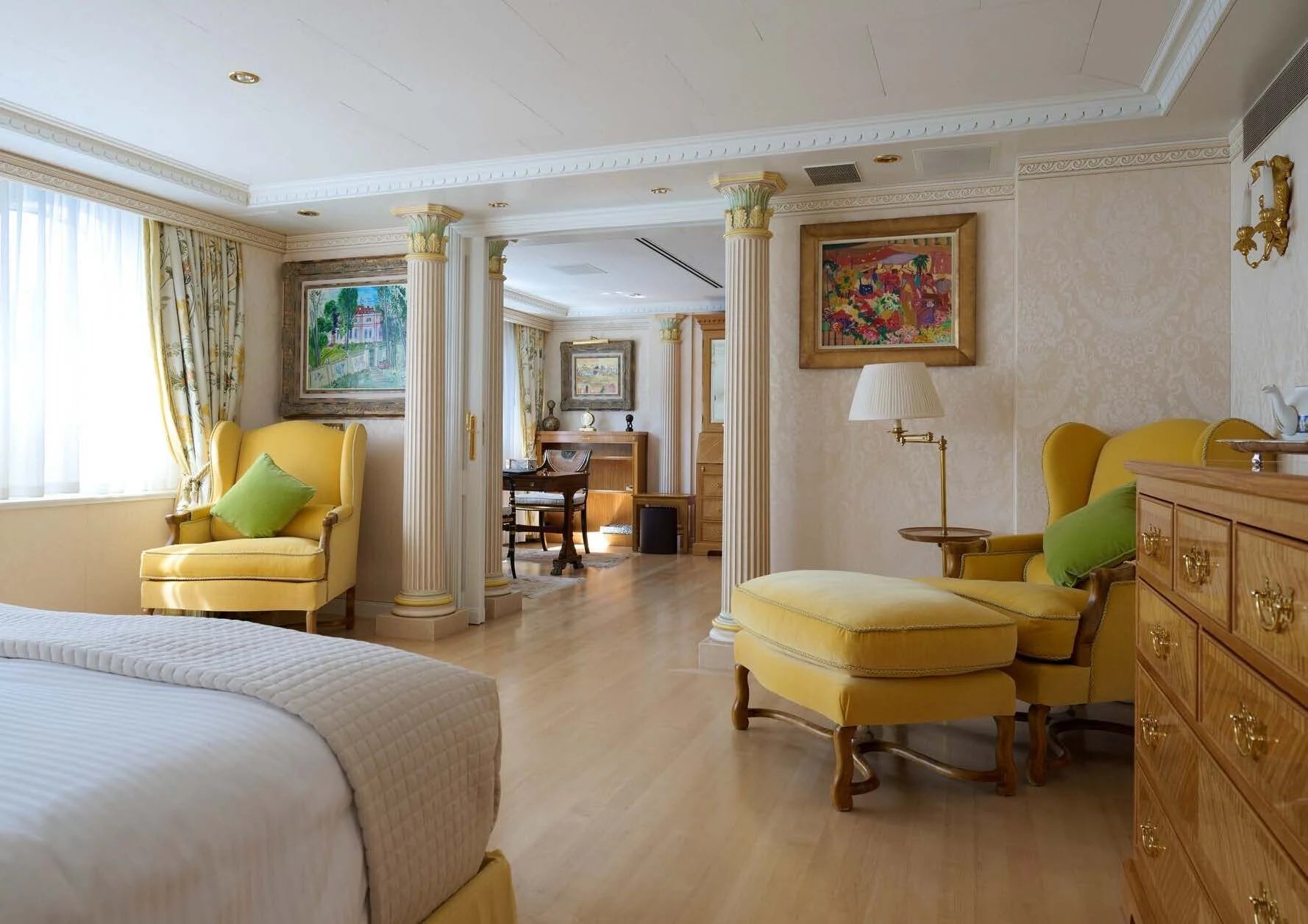 a bedroom with a bed and a desk aboard LADY BEATRICE Yacht for Sale
