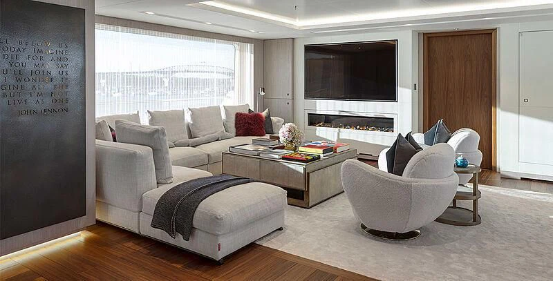 a living room with a couch and a coffee table aboard PROMISE Yacht for Sale