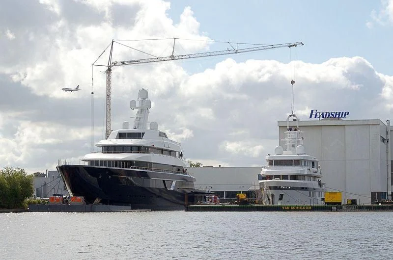 a large ship docked at a port aboard PROMISE Yacht for Sale
