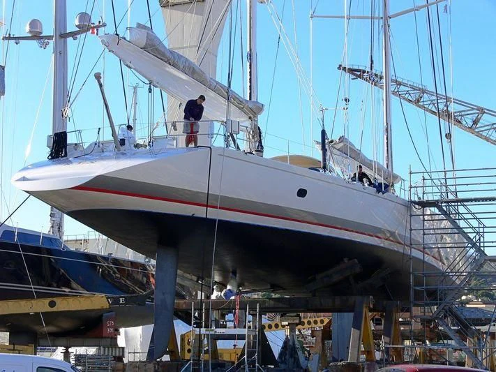 a boat with a person standing on the deck aboard MARI-CHA III Yacht for Sale