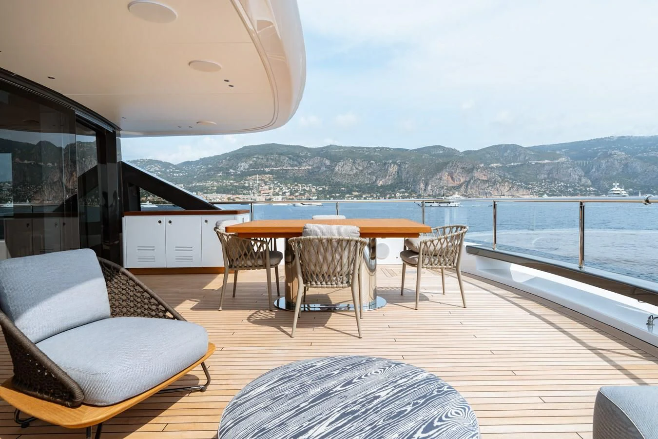 a room with a table chairs and a large body of water aboard WAVE Yacht for Sale