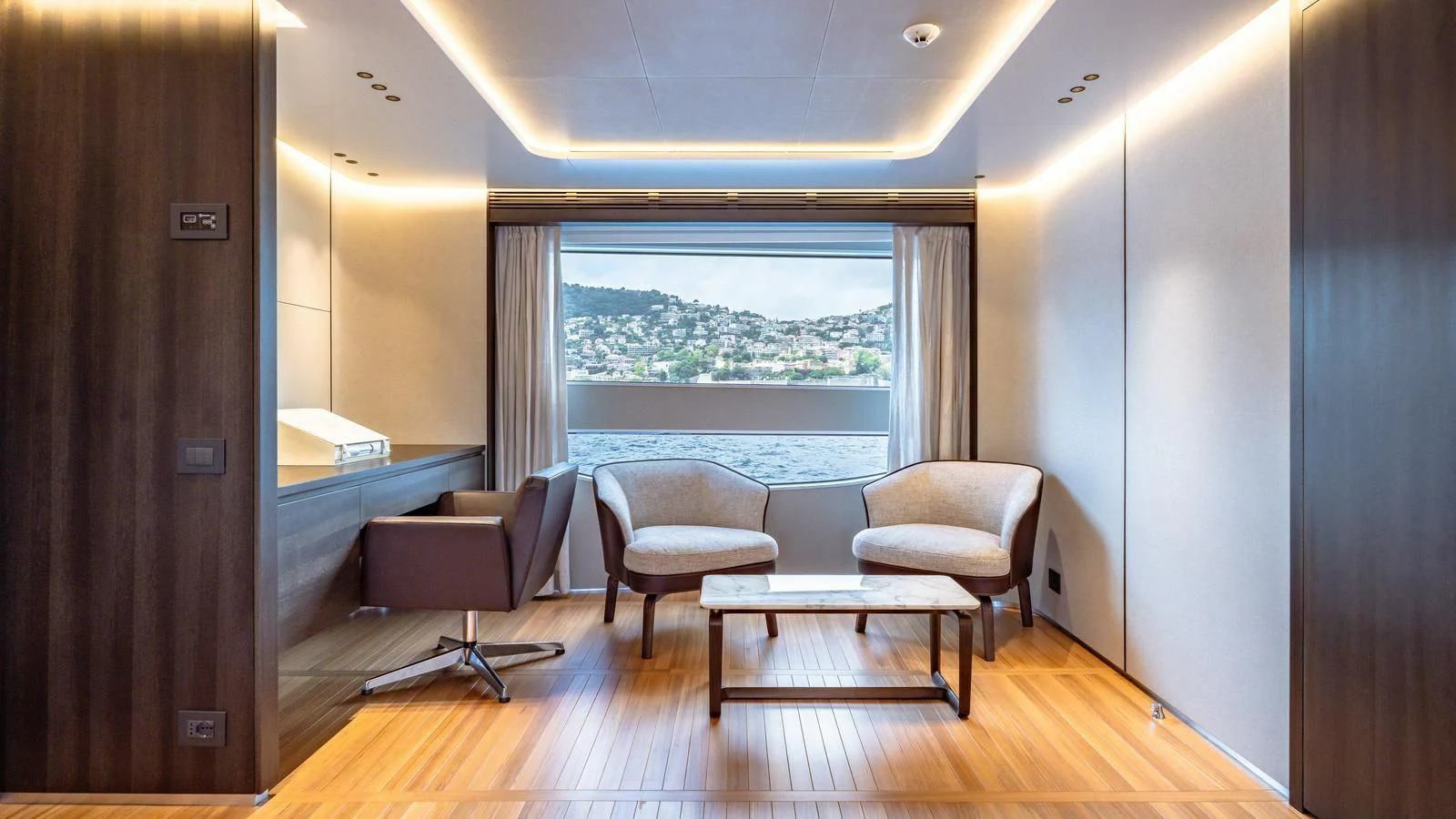 a room with a table chairs and a window aboard WAVE Yacht for Sale