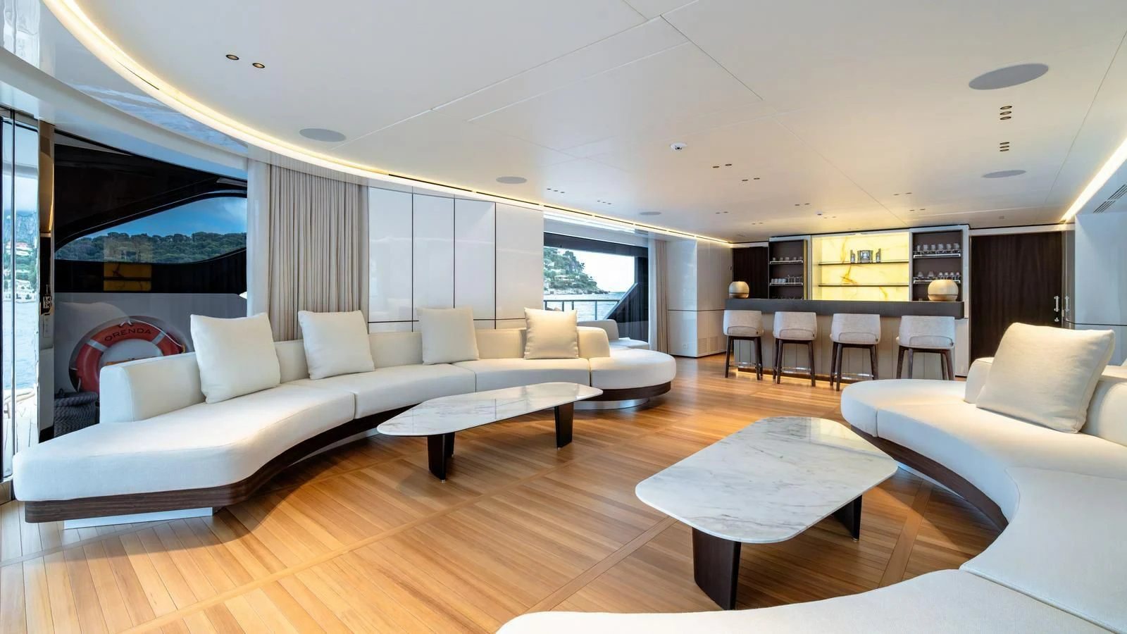 a living room with a large window aboard WAVE Yacht for Sale