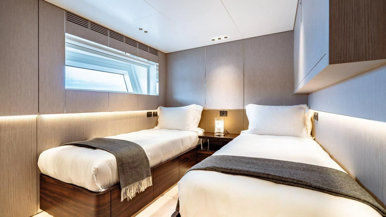 a couple of beds in a room aboard WAVE Yacht for Sale