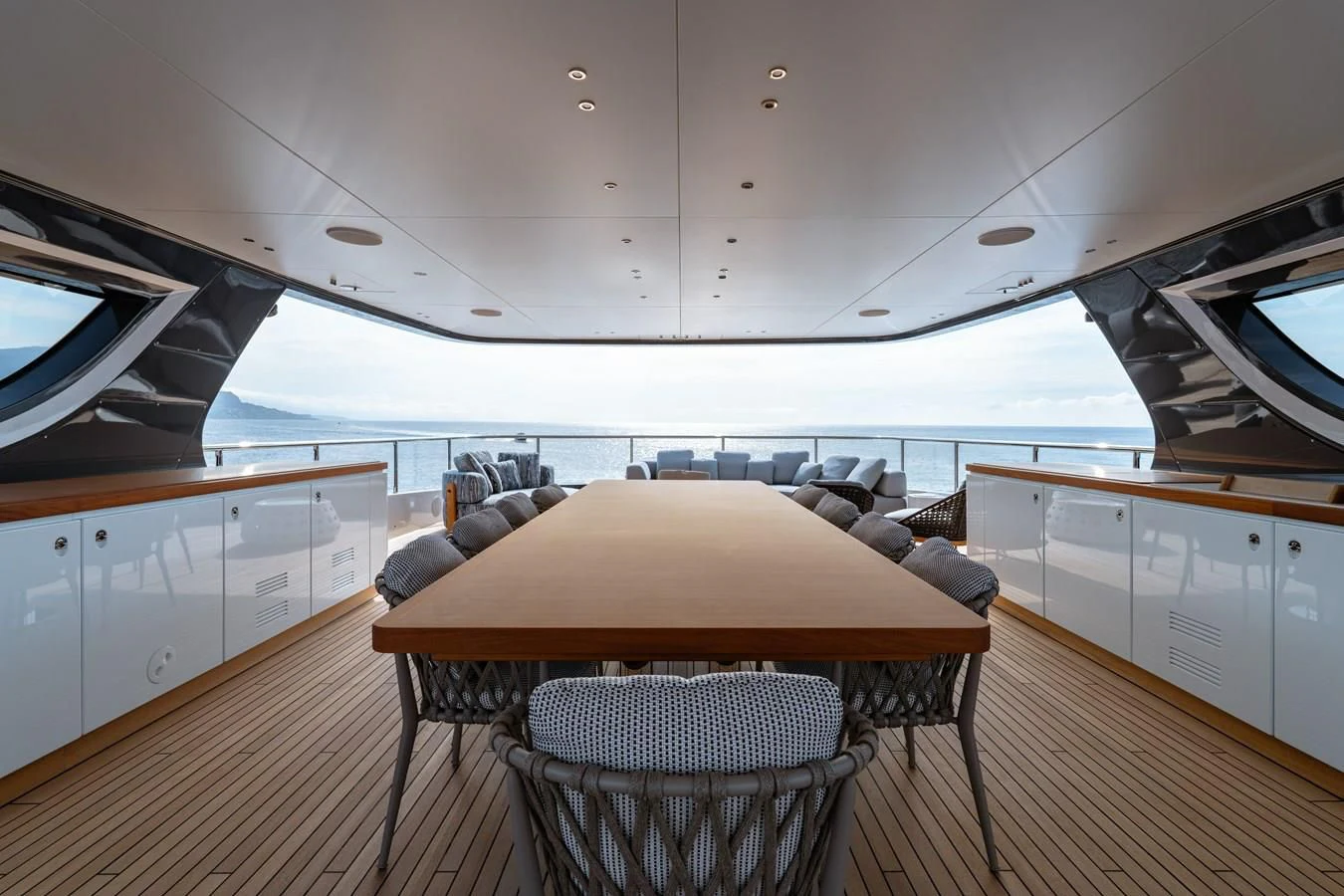 a large kitchen with a table aboard WAVE Yacht for Sale