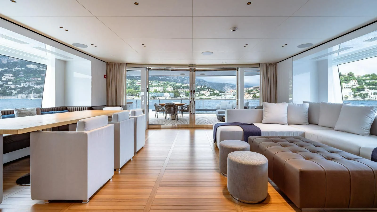 a living room with a large window aboard WAVE Yacht for Sale