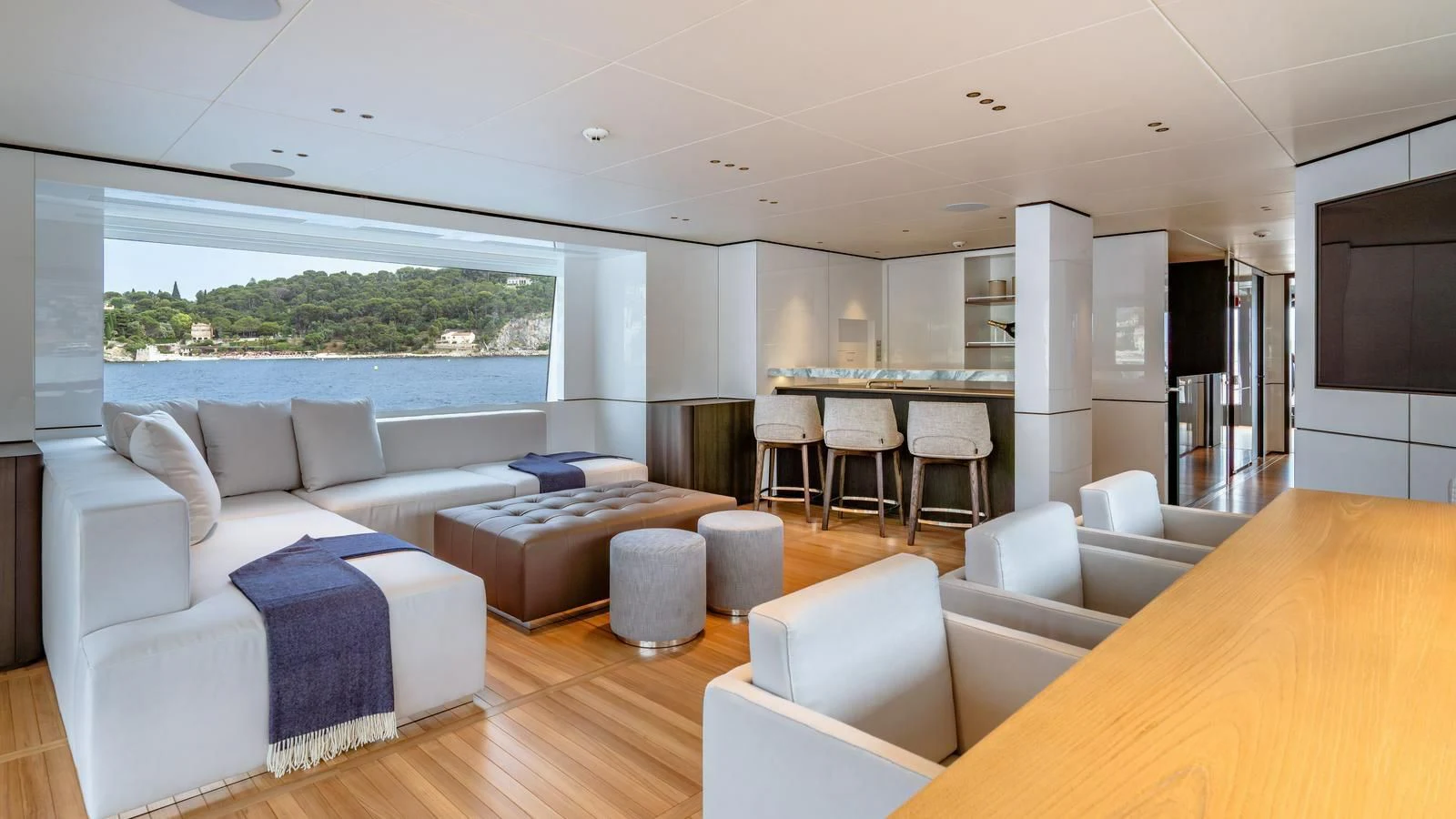 a living room with a large window aboard WAVE Yacht for Sale