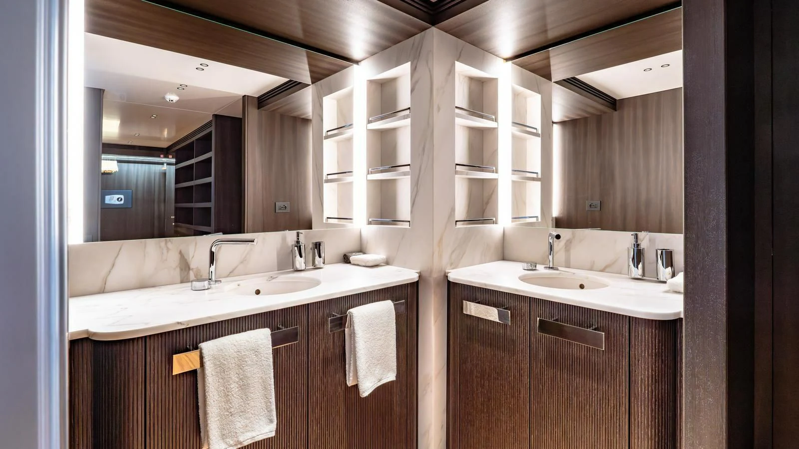 a bathroom with a large mirror aboard WAVE Yacht for Sale