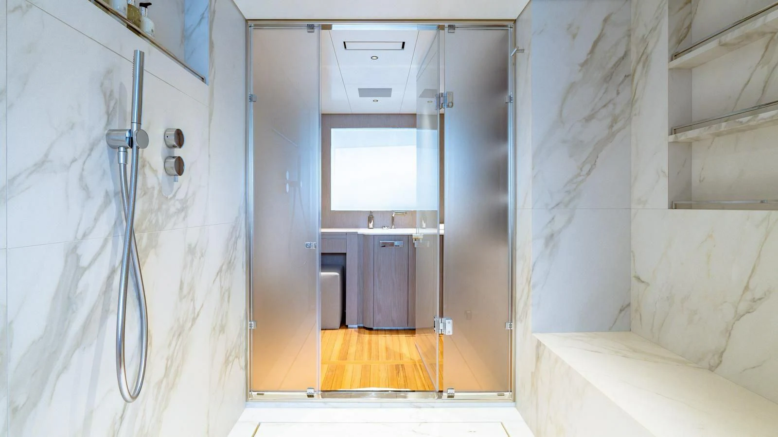 a bathroom with a shower and sinks aboard WAVE Yacht for Sale