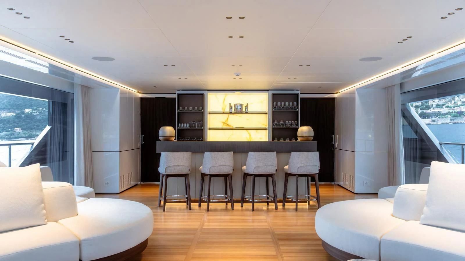 a large living room with a large table and chairs aboard WAVE Yacht for Sale