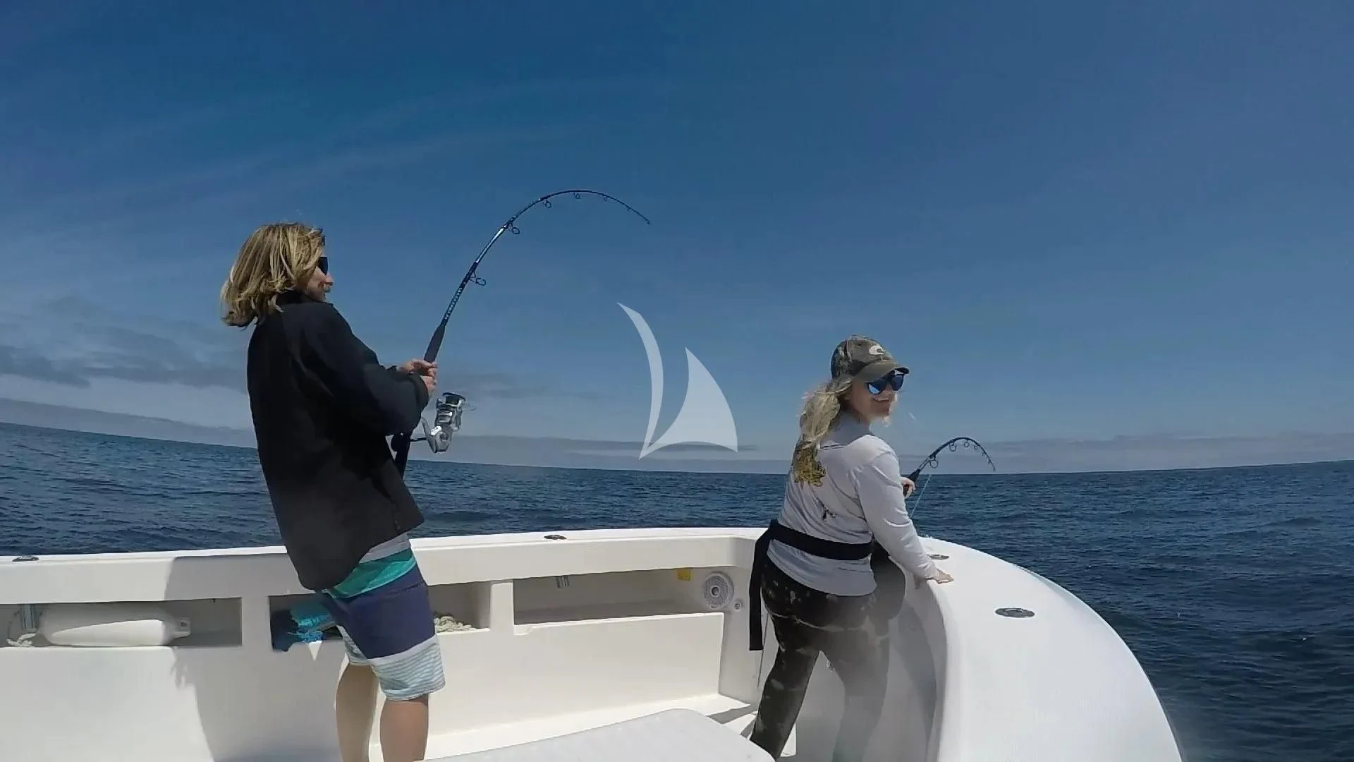 a person on a boat holding a fishing pole aboard MEMORIES Yacht for Sale