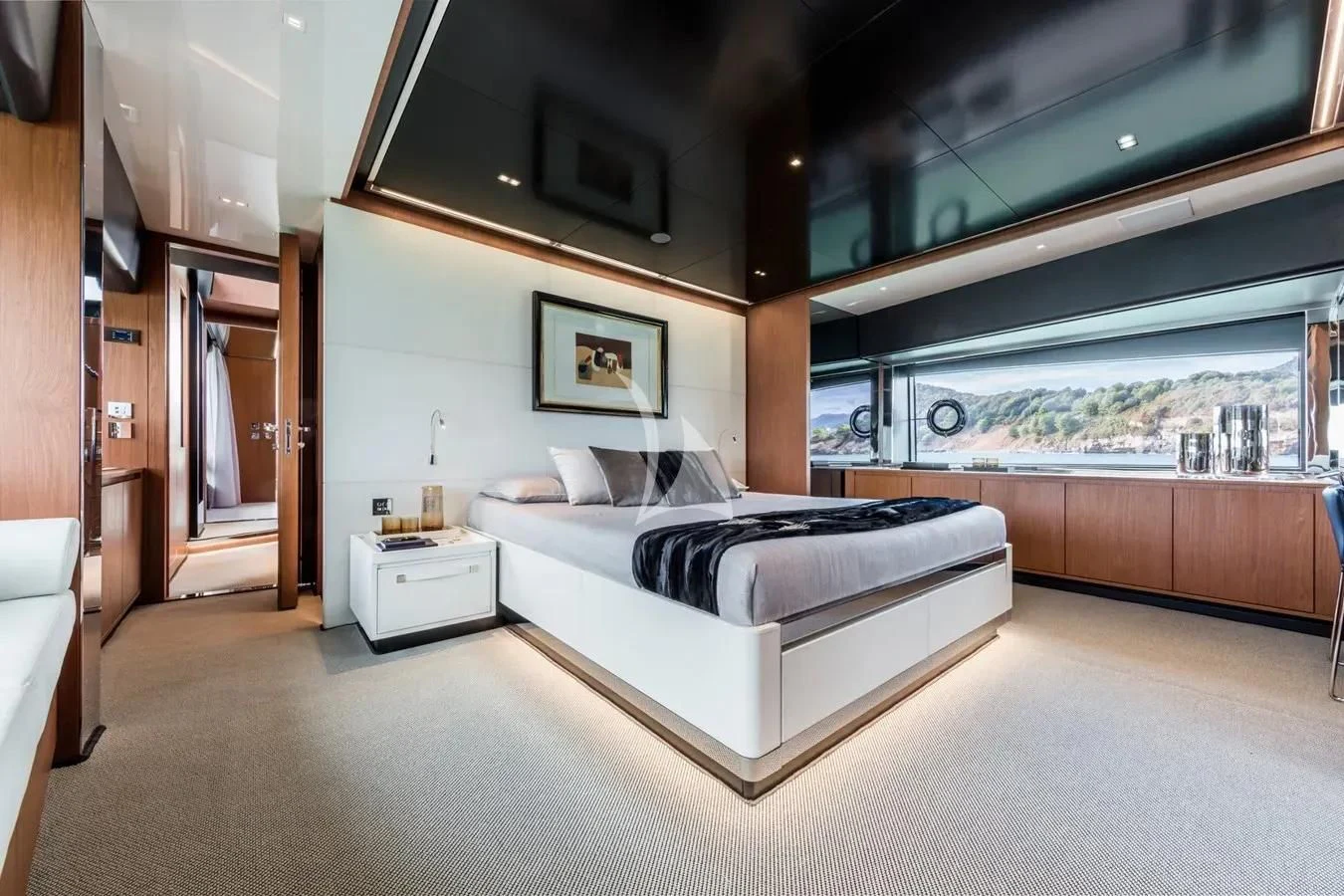 a room with a bed and a tv on the wall aboard MEMORIES Yacht for Sale