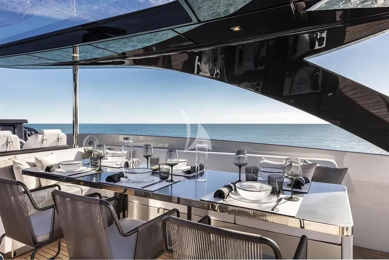 a table with wine glasses on it aboard MEMORIES Yacht for Sale