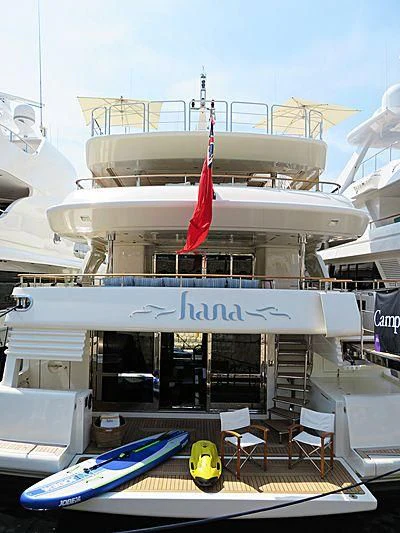 a large white ship docked aboard HANA Yacht for Charter