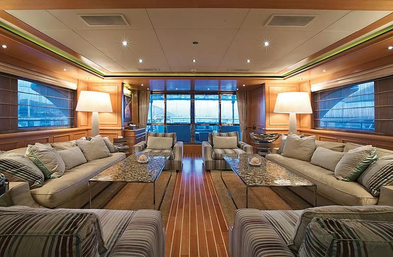 a living room with a large window aboard HANA Yacht for Charter