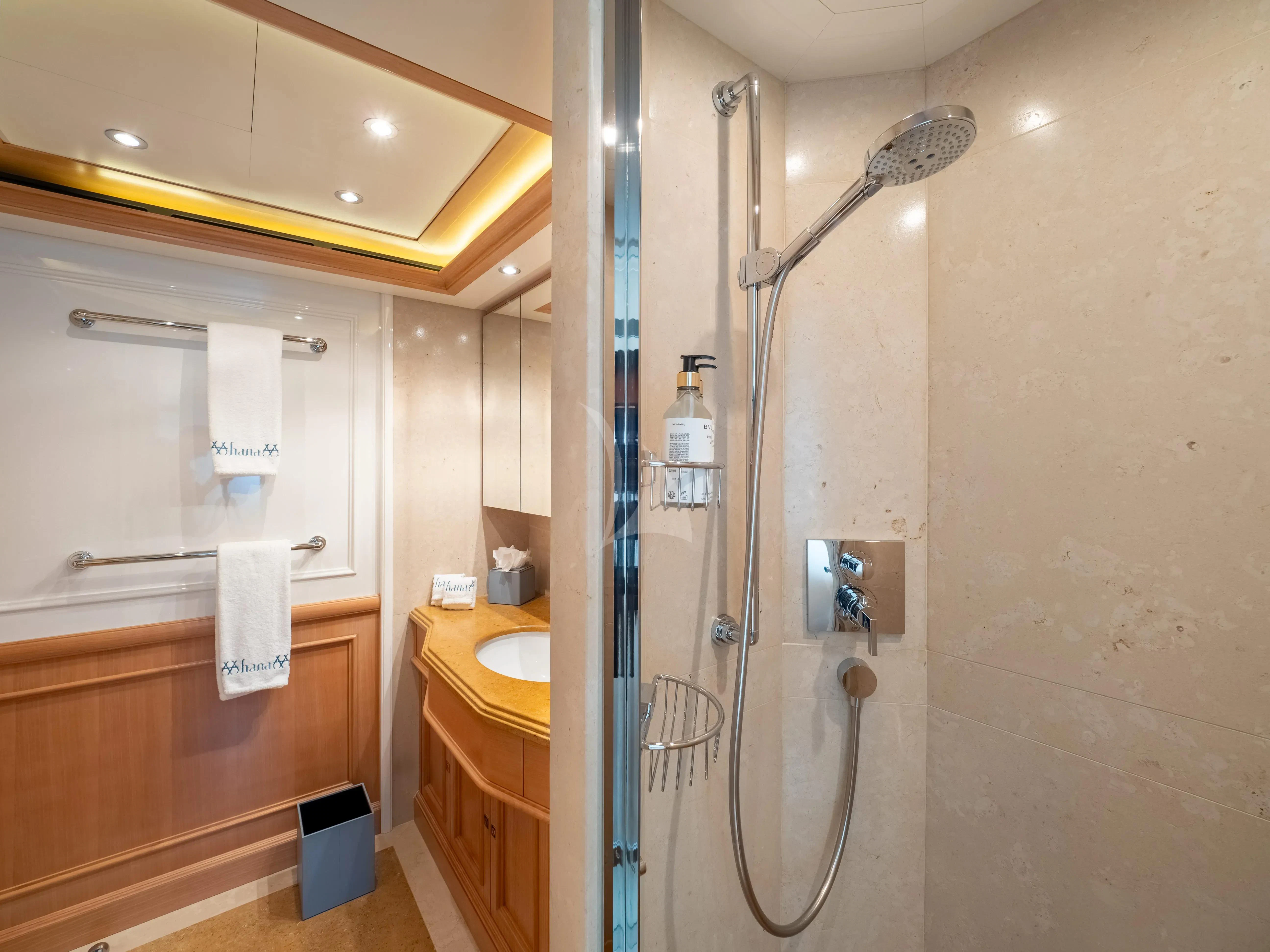 a shower unit in a bathroom aboard HANA Yacht for Charter