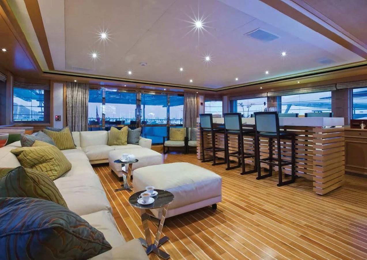 a living room with a large window aboard HANA Yacht for Charter