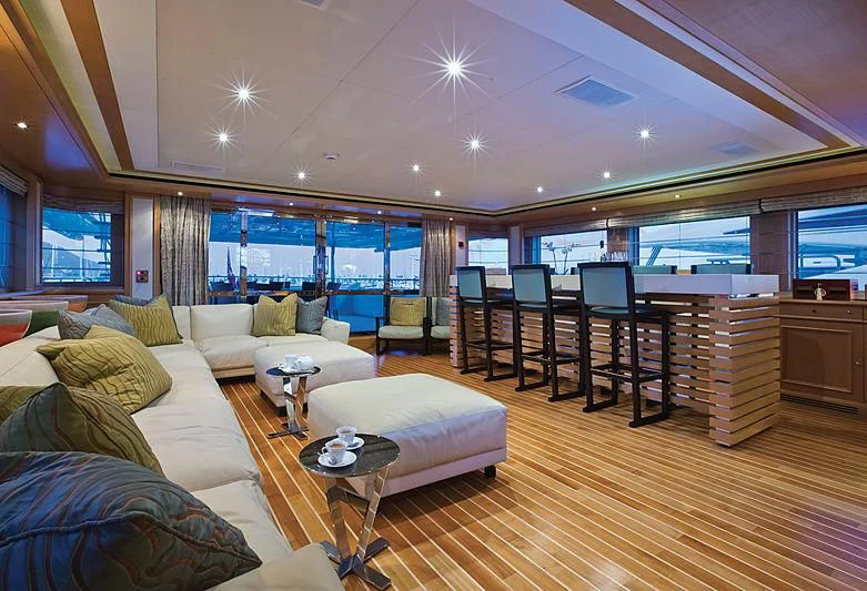 a living room with a large window aboard HANA Yacht for Charter