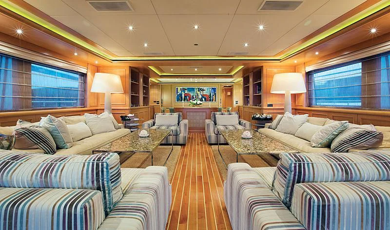 a room with a couch and a table and a bed aboard HANA Yacht for Charter