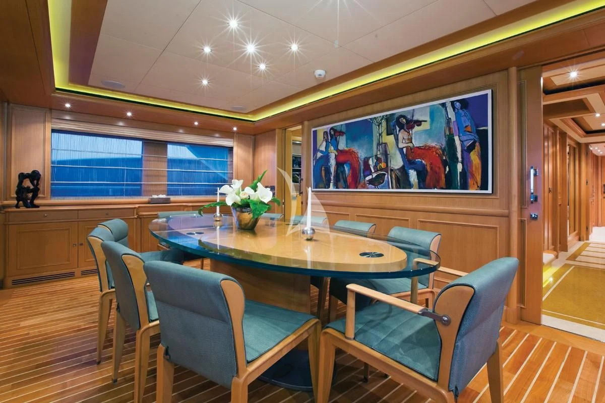 a room with a table and chairs aboard HANA Yacht for Charter