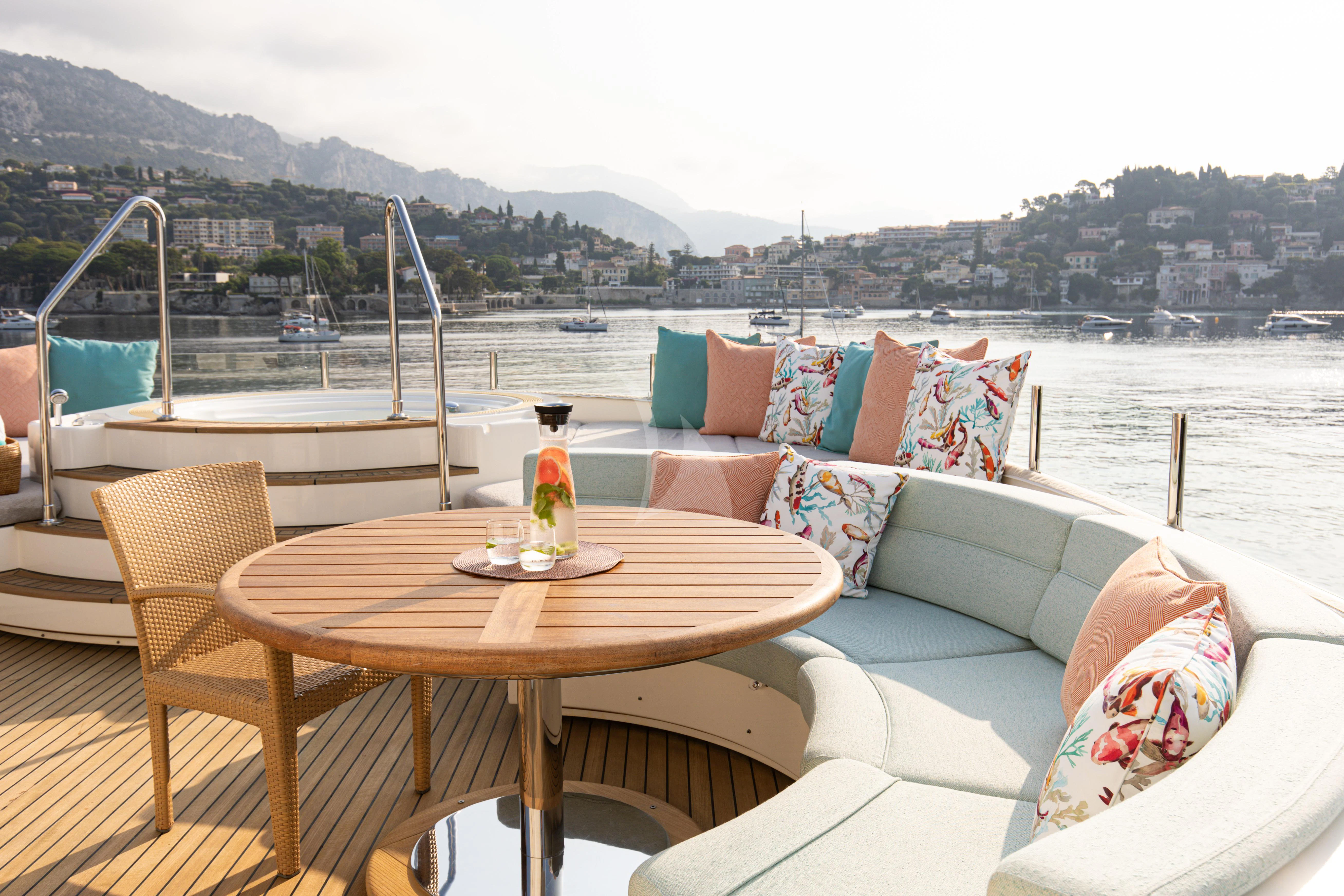 a table and chairs on a boat aboard HANA Yacht for Charter
