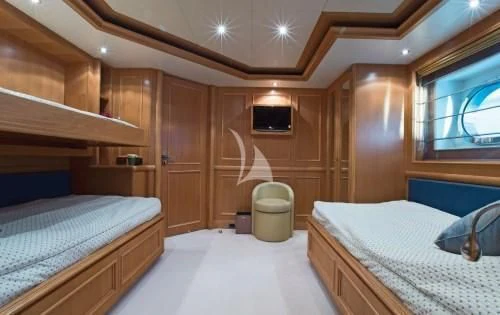 a room with two beds aboard HANA Yacht for Charter