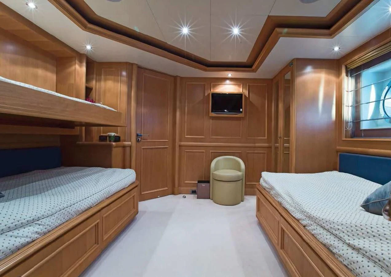a room with two beds aboard HANA Yacht for Charter