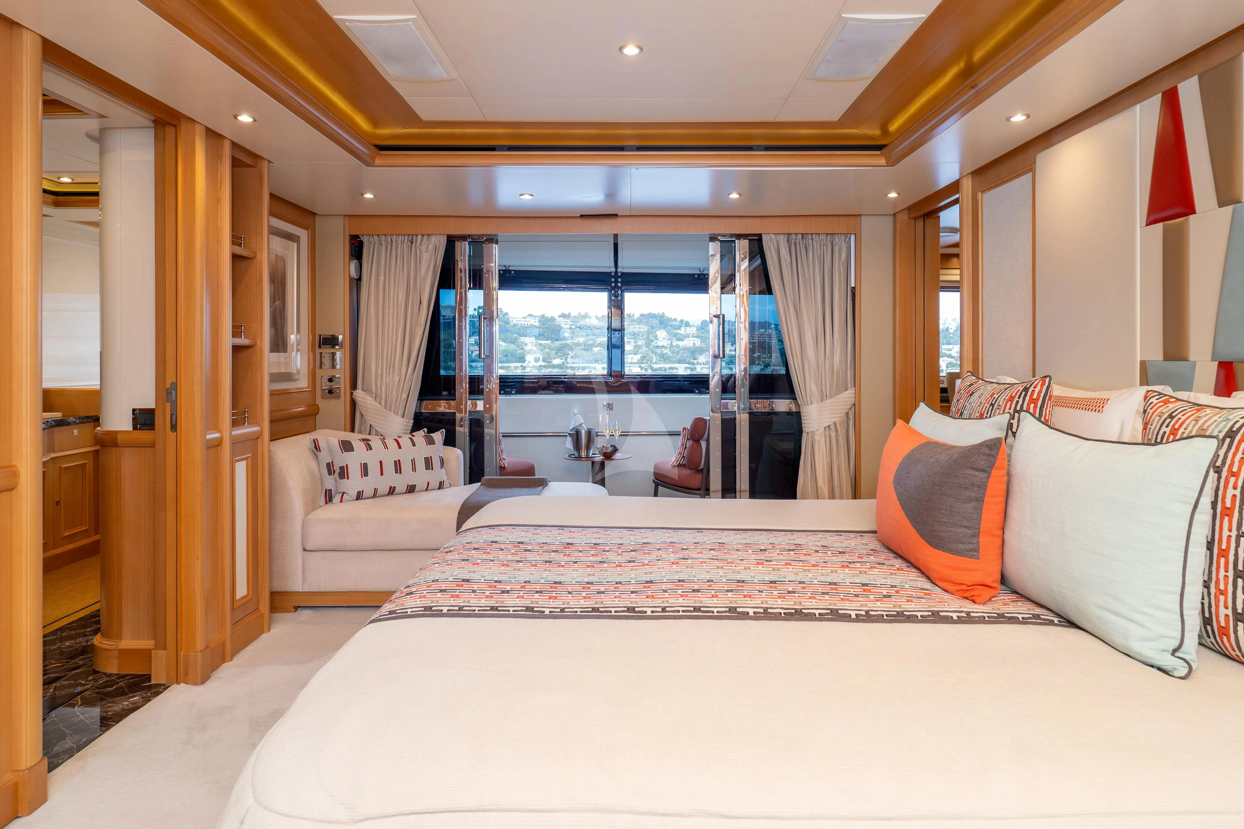 a bedroom with a large bed aboard HANA Yacht for Charter