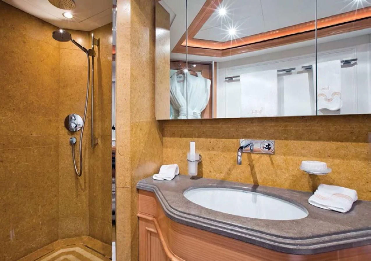 a bathroom with a sink and a mirror aboard HANA Yacht for Charter