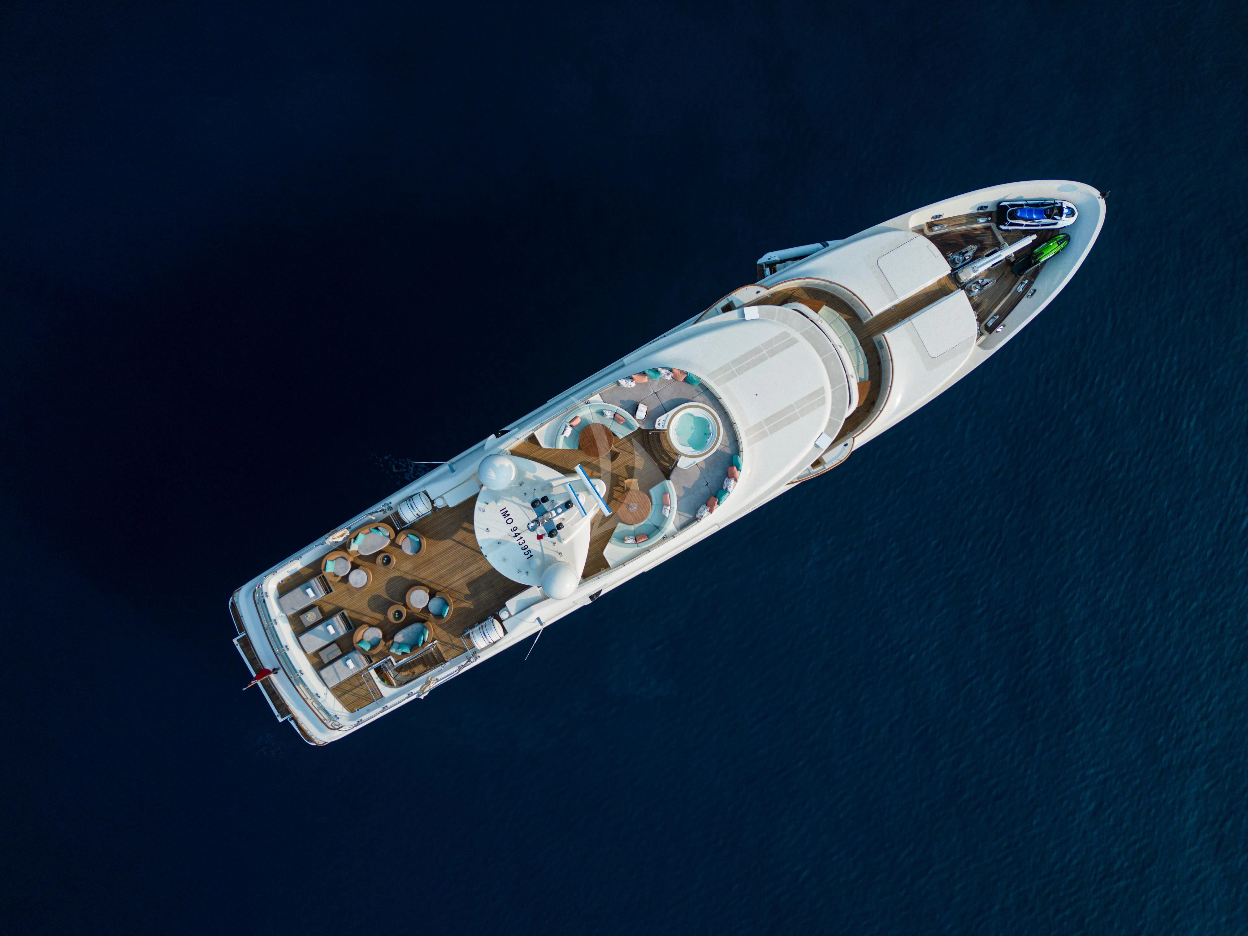 a silver and gold guitar aboard HANA Yacht for Charter