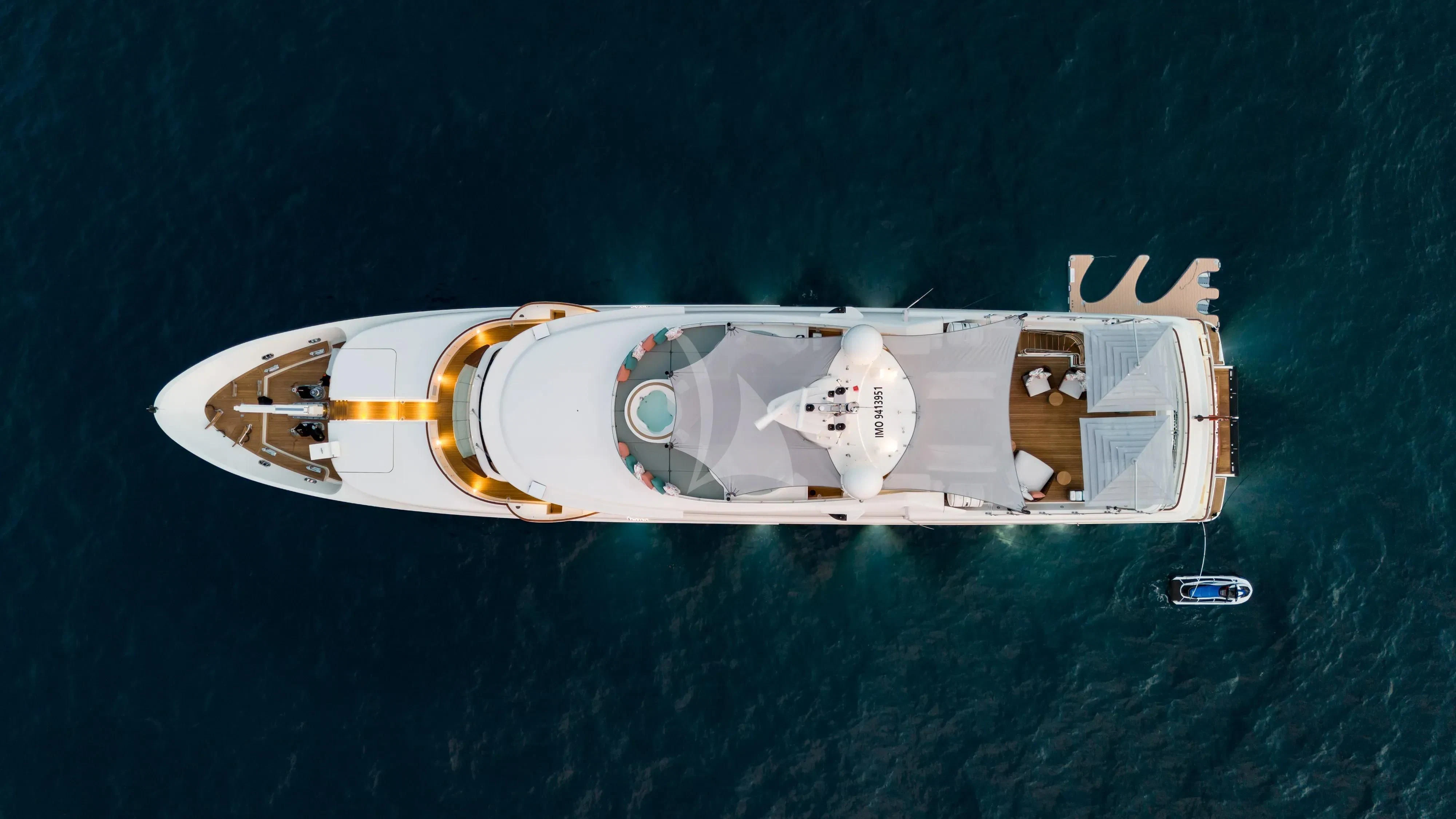 a space ship with a yellow logo aboard HANA Yacht for Charter